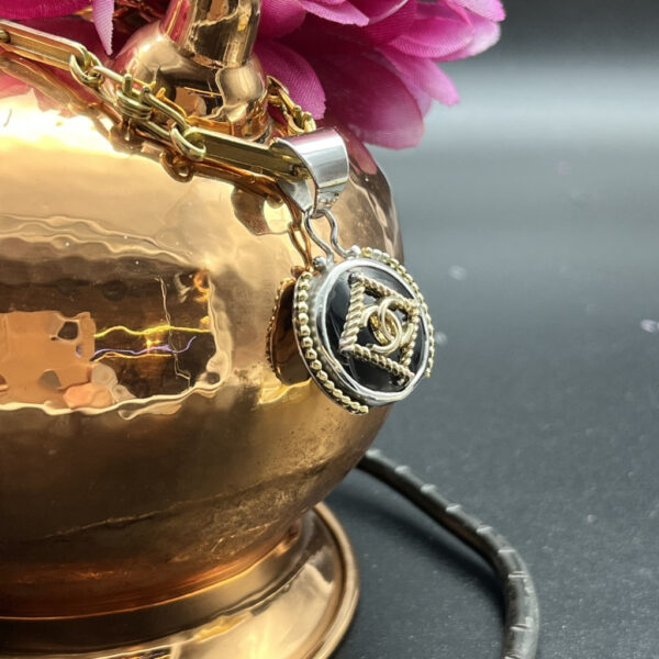 Chanel black gold button pendant