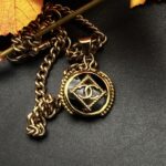 "Eloise" Vintage Chanel Black Gold Button Pendant