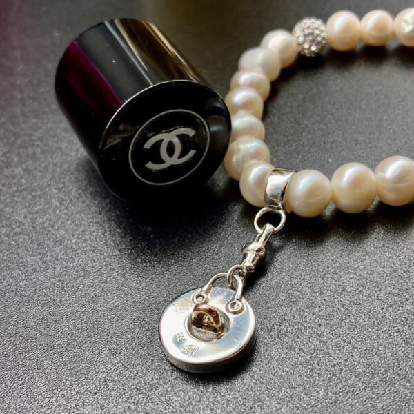 Chanel button charm Chanel button bracelet Vintage Chanel button jewellery Vintage Chanel button jewelry Chanel pearls White Chanel bracelet Chanel Pearl Bracelet