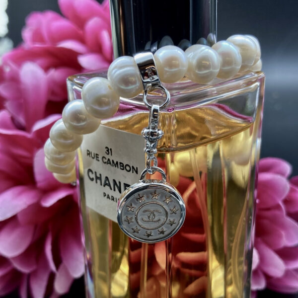 Chanel button charm Chanel button bracelet Vintage Chanel button jewellery Vintage Chanel button jewelry Chanel pearls White Chanel bracelet Chanel Pearl Bracelet